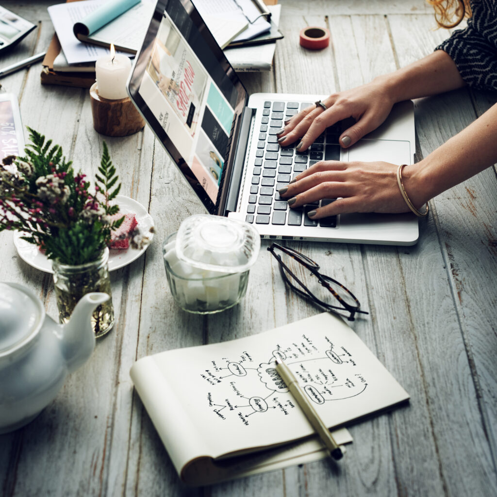 side view of woman using computer laptop